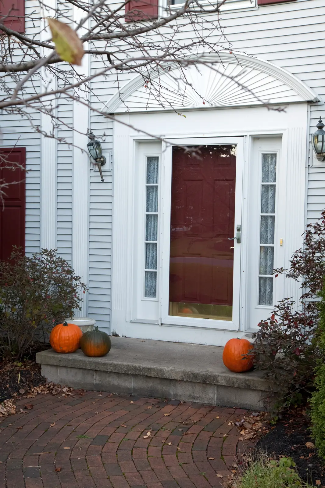 Brick walkway front entry fall plantings