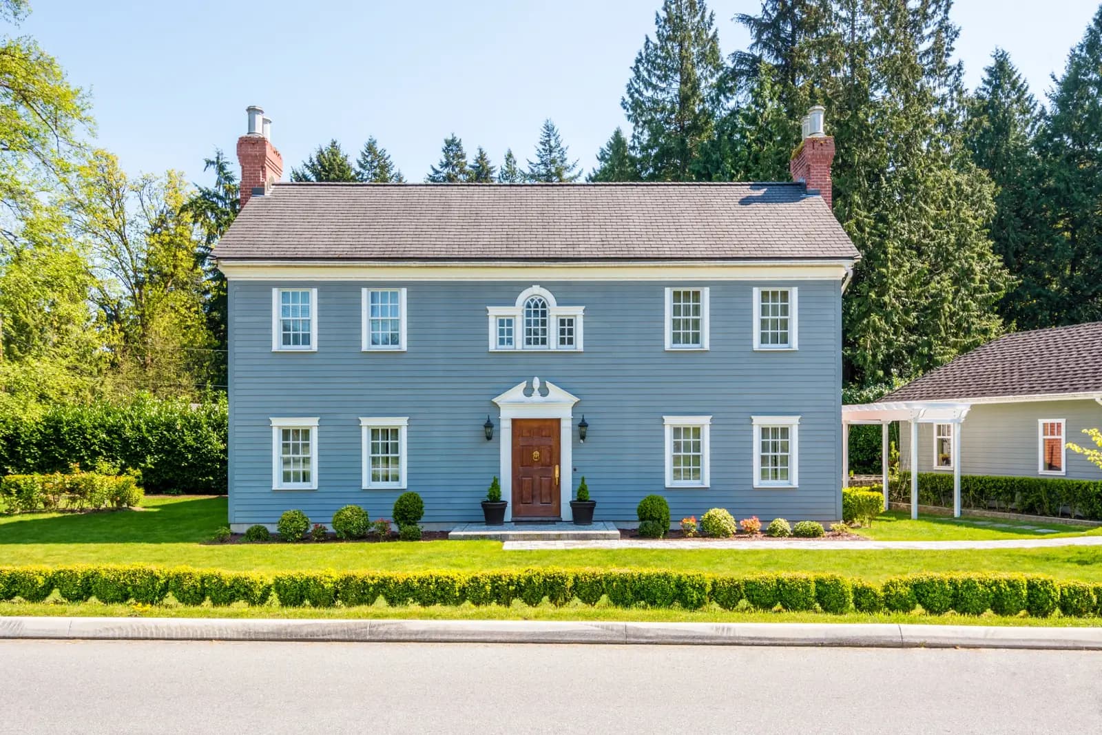 Healthy green lawn in front of a Cape Cod home